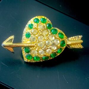 Vintage gold tone rhinestone heart and arrow.